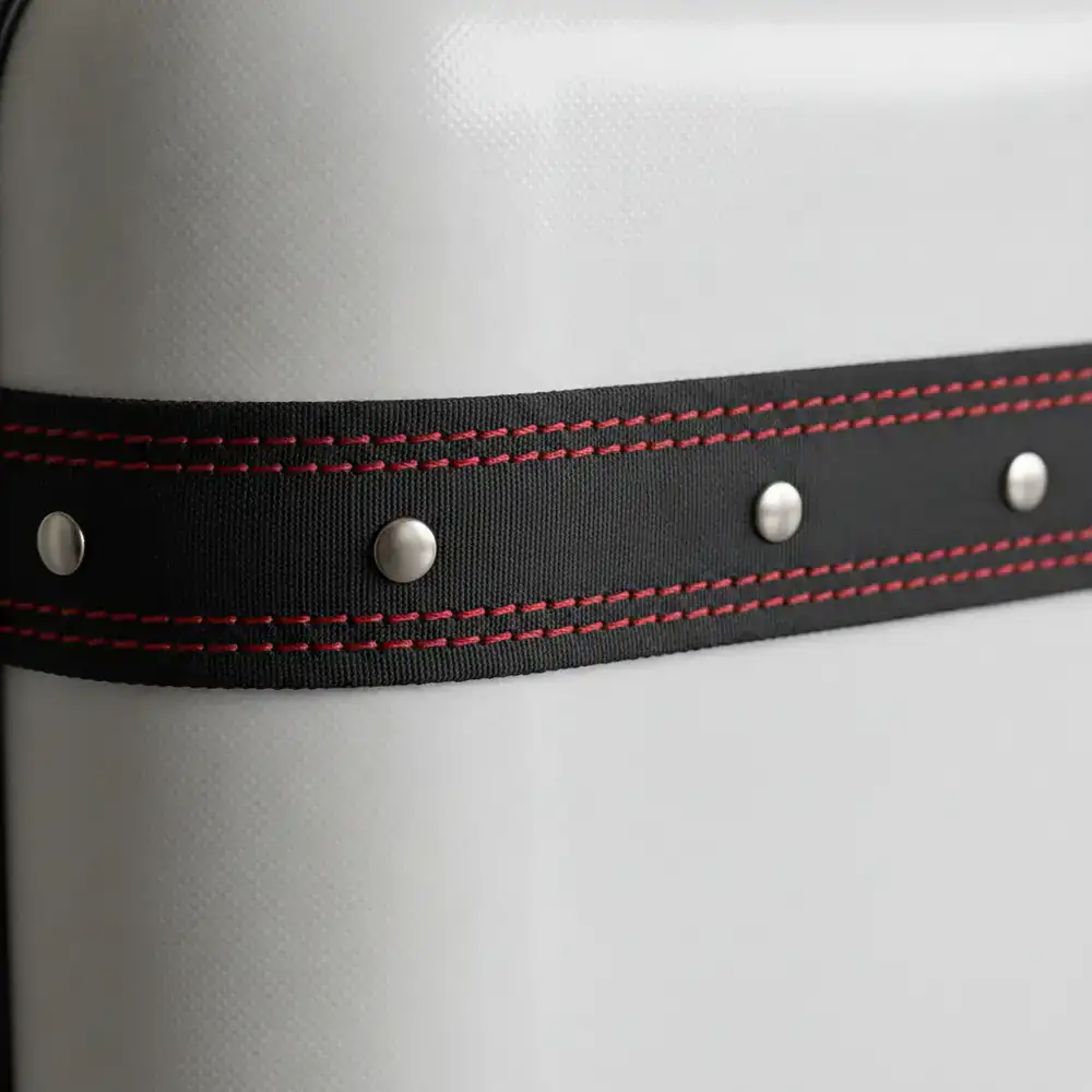 Close up of reinforced stitching and polycarbonate shell on CleverGuide luggage